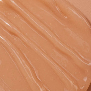 Close-up of a smooth, beige-colored gel or cream on a matching background